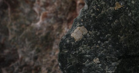 Close-up of a sharp-edged dark green stone