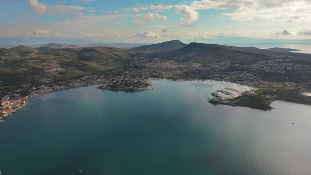Aerial View of Foca Town, Turkey, Showcasing Its Harbor, Mountains, and Cityscape