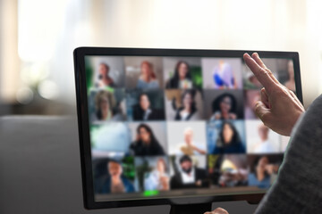 Man talking with diverse colleagues on virtual video conference using computer at home. Man working...