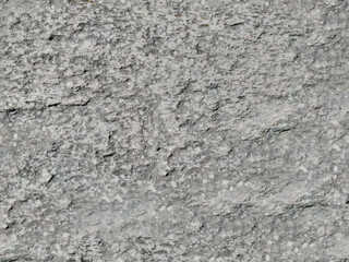 Obraz premium Old unsmooth cement wall texture for template or background. Uneven cement texture, highlighting the natural imperfections and coarse finish, suitable for realistic building material visuals