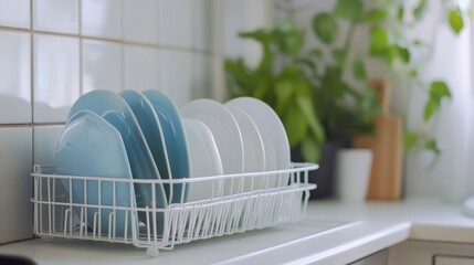 Modern Kitchen Scene Featuring Clean, Stackable Plates in Soft Colors with Fresh Greenery and Natural Light, Perfect for Home Decor and Culinary Inspiration