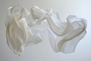 white sheer fabric floating on a plain background