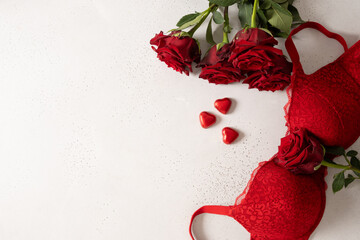 Valentine's day romantic sensual concept. Red lace lingerie, bustier underwear, candy sweets and...