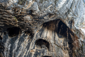 Fototapeta premium Interior of the large hall of old Karain cave, hidden in Mediterranean region. Confirms human habitation since the early Paleolithic age between 150,000 and 200,000 years ago.Yagca, Antalya, Turkey.