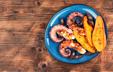 Grilled octopus with vegetables.