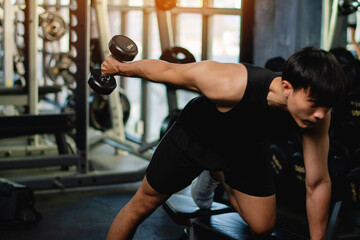 Fototapeta premium Dumbbell exercises, muscle building and good health, weight lifting and heavy training.