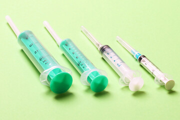 Top view of medical syringes on colorful background with copy space. Injection equipment concept