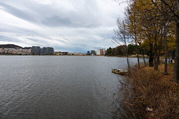 Autumn colors of trees at the artifical lake and park of Tirana, Albania