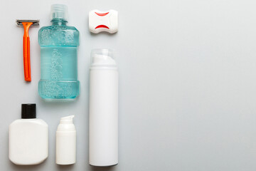 Composition with bath cosmetics on table. razor, toothpaste, soap, gel, toothbrush, mouthwash and other various accessories. Cosmetics for skin health. Bath Mockup for your logo