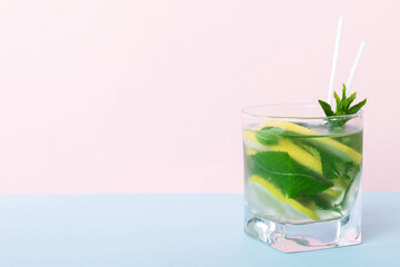 Mojito summer refreshing cocktail with ice and mint. mojito cocktail with lime, lemon and mint in a tall glass with a stick