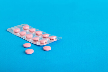Blister package with Vitamin on color background. Medicine pills on a light background. Medicines...