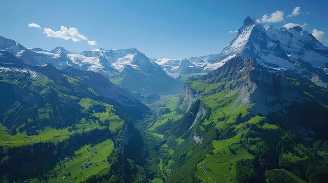 A stunning aerial view of the Swiss Alps in summer, with lush green valleys, snow-capped peaks, and clear blue skies