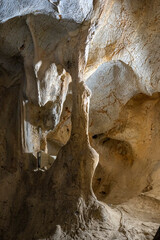 Interior of the large hall of old Karain cave, hidden in Mediterranean region. Confirms human habitation since the early Paleolithic age between 150,000 and 200,000 years ago.Yagca, Antalya, Turkey.