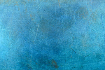 bright blue background with abstract scratches or streaks