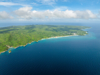 Tropical landscape of Carabao Island with blue sea and waves. San Jose, Romblon. Philippines....