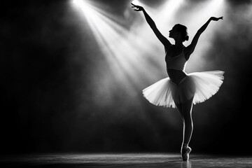 Silhouette of a ballet dancer in dramatic lighting.