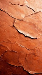 Fototapeta premium A close up of a red rock wall with cracks