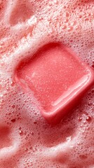 Fototapeta premium A close up of a pink ice cube in a bubble bath
