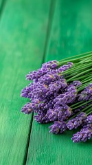 A bunch of lavender flowers sitting on top of a green table