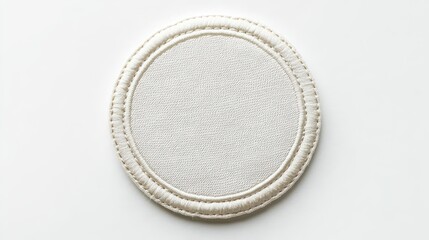 Cream circular coaster with fabric texture and stitched border. Perfect for adding your own design or logo for branding.