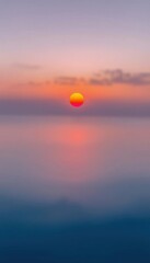 Obraz premium view of a sunset over the ocean with red sun over paradise