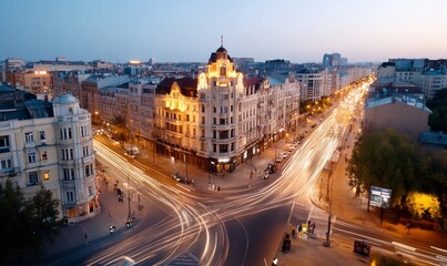 Fototapeta premium Cityscape at dusk with light trails and historic building.