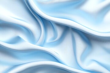 Soft blue fabric with gentle folds creates an elegant, smooth texture. The flowing drapery evokes a sense of calm and luxury, perfect for backgrounds or design inspiration.