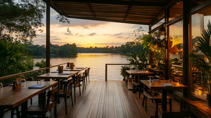 Fototapeta premium Waterfront Restaurant: Sunset Dining on a Wooden Deck
