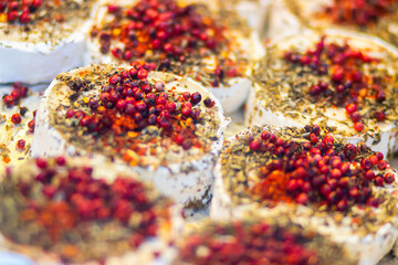 A close-up of Zhejiang’s traditional fermented tofu,  or stinky tofu, showcases rich textures, vibrant spices, and cultural essence, highlighted against a soft, warm background