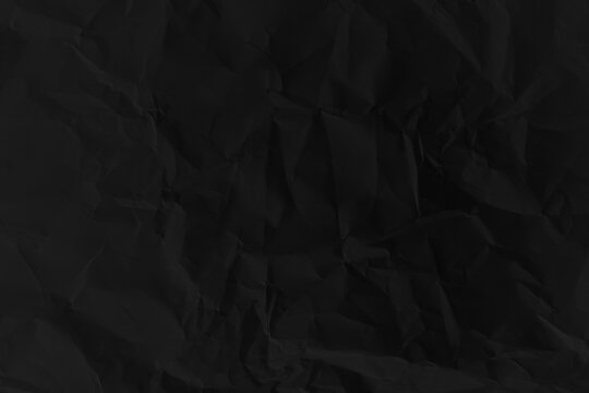 Old black grunge background. Dark paper texture
