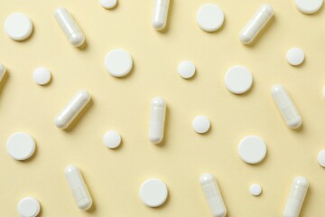 White pills on a colored background