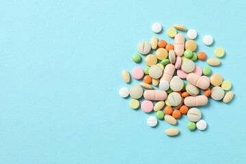 Various pills on a colored background
