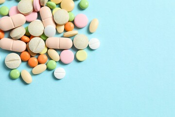 Various pills on a colored background