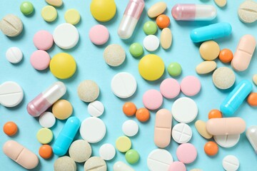 Various pills on a colored background