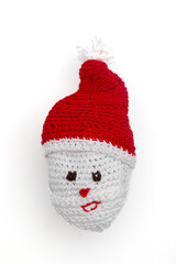 Handmade Crochet Santa Claus Ornament on White Background – Christmas Holiday Decoration
