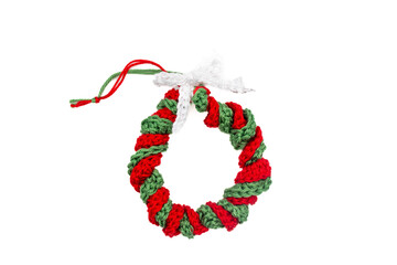 Handmade Crochet Christmas Wreath Ornament in Red and Green on White Background