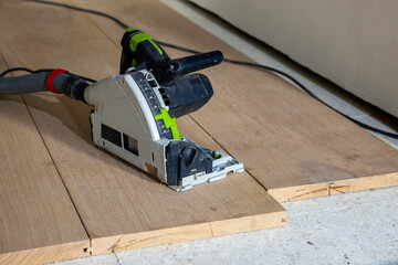 Circular Saw on Wooden Floorboards in Construction Setting