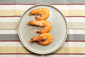 Boiled large shrimps on plates.Food concept.Seafood.Diet