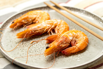 Boiled large shrimps on plates.Food concept.Seafood.Diet