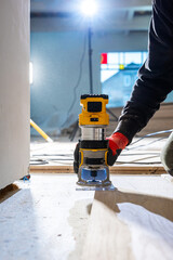 Close Up of Wood Router in Use with Safety Gear in Indoor Workspace