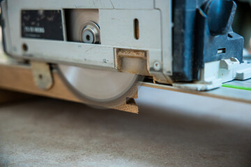 Close Up of Circular Saw Cutting Through Wood with Precision