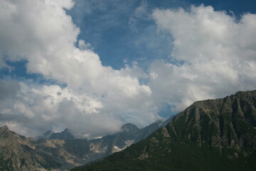 Fototapeta premium The top of a mountain with clouds