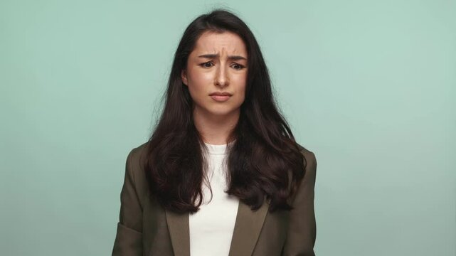 Perplexed young woman showing a 'why did you do this' gesture, conveying confusion and questioning.