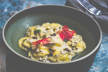 Ravioli Truffle with truffle French cream sauce, Italian Parmiggiano Reggiano cheese, Italian truffle puree and truffle lace oil