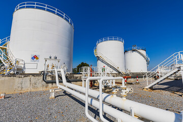 Crude Oil Industry, White Storage Fuel Gas Container Tanks in Petroleum Refinery Industrial Factory...