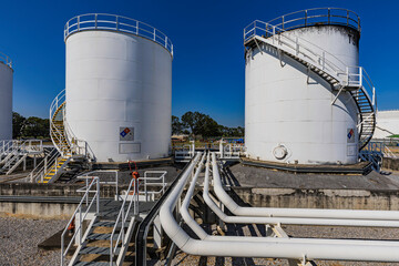 Crude Oil Industry, White Storage Fuel Gas Container Tanks in Petroleum Refinery Industrial Factory...