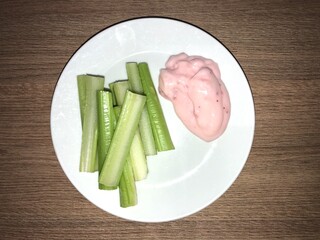 Freshly chopped celery pieces served with creamy yogurt create a perfect blend of crunch and smoothness. This healthy snack offers a refreshing taste, packed with nutrients and is ideal for light meal