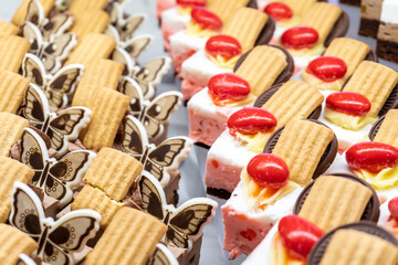 Savoyardi cakes with chocolate cream and chocolate decorations