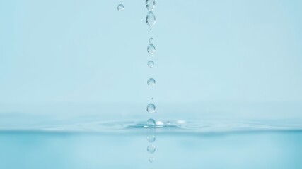 Serene Water Droplets Falling into Still Aqua Surface