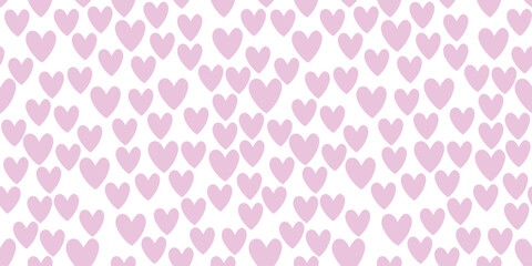 Seamless abstract pattern of small pink hearts on white background. Love backdrop, cute texture for textile, wrapping paper, Valentine's day.